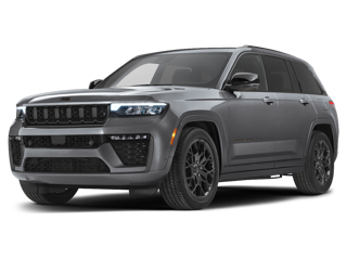 A sleek gray Jeep Grand Cherokee SUV with black rims and accents, facing forwards slightly left.