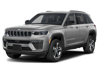 A sleek gray Jeep Grand Cherokee SUV with black rims and accents, facing forwards slightly left.