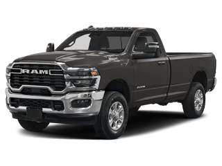 Front 3/4 view of a dark gray Ram 2500 pickup truck with chrome accents against a black background.